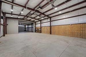 Garage featuring metal wall