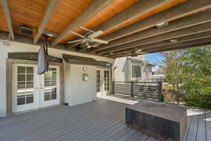 Wooden deck featuring french doors
