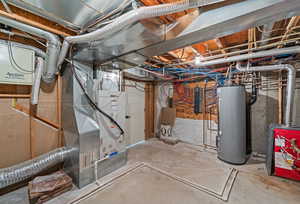 Unfinished below grade area with water heater, heating unit, and a heating unit