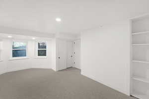Unfurnished bedroom featuring recessed lighting and carpet