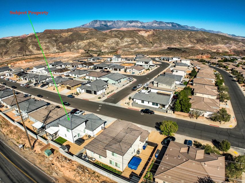 Aerial view of residential area with a mountainous background