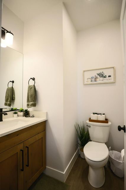 Bathroom with vanity and dark wood-type flooring
