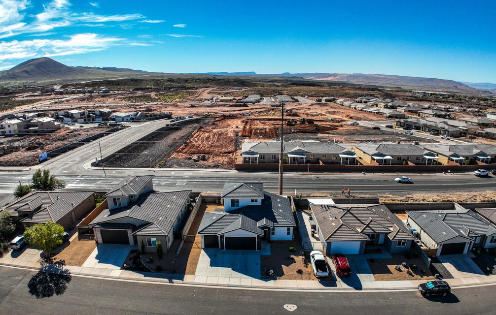 Aerial perspective of suburban area with a mountainous background