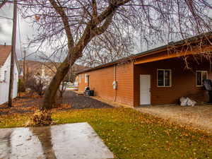 View of side of property with a yard