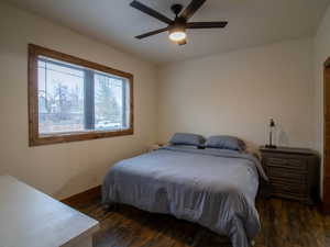 Primary Bedroom featuring dark wood-style floors and a ceiling fan