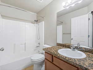 Bathroom with vanity,  shower combination, and light tile patterned floors