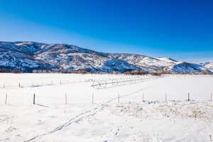 View of mountain backdrop featuring rural landscape