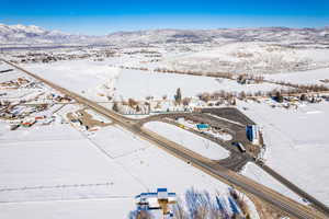 Snowy aerial view with a mountain view