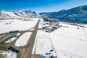 Snowy aerial view featuring a mountain view