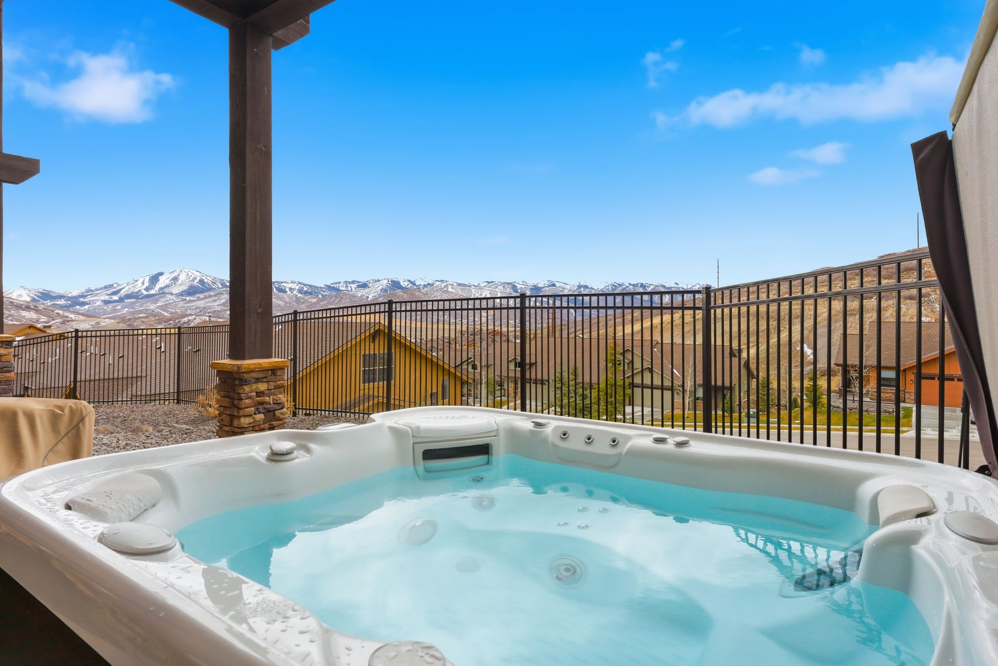 View of swimming pool featuring a hot tub and a mountain view