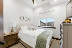 Bedroom featuring ceiling fan, light colored carpet, and recessed lighting