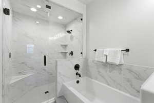 Full bath with a garden tub and a marble finish shower