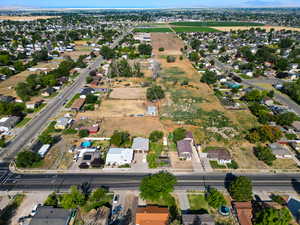 Aerial view of property's location with nearby suburban area