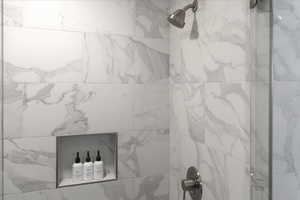 Bathroom view of a marble finish shower