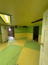 Additional living space featuring secured water heater and carpet flooring