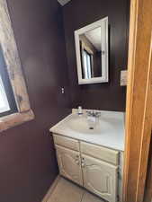 Bathroom with vanity and light tile patterned floors