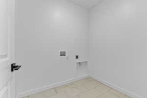 Laundry area featuring hookup for a washing machine and hookup for an electric dryer