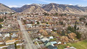 Aerial view of property's location with mountains and nearby suburban area