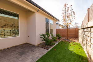 Fenced backyard with a patio