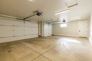 Garage featuring a garage door opener