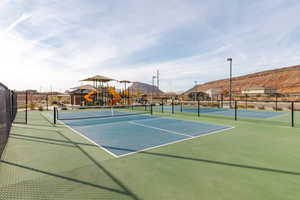 View of tennis court featuring a mountain view
