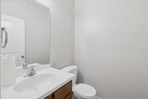 Bathroom featuring vanity and toilet