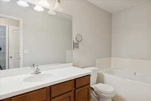 Full bath featuring a bath and vanity