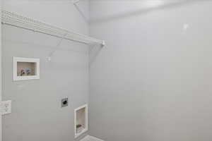 Washroom featuring washer hookup and hookup for an electric dryer