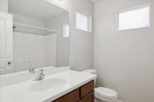 Full bath with vanity and a shower