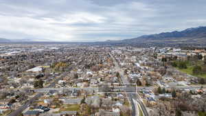 Aerial view of property and surrounding area with mountains