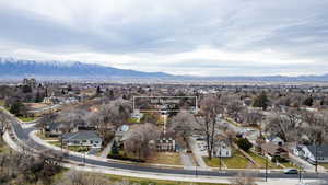 Aerial view of residential area featuring mountains and property parcel outlined