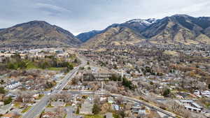 View of mountain backdrop featuring nearby suburban area