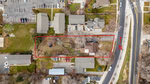Aerial view of residential area featuring property parcel outlined