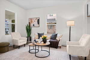 Sitting room featuring wood finished floors and baseboards