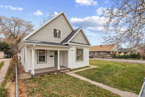 Bungalow-style house with a porch and roof with shingles