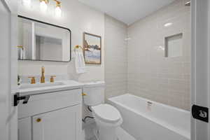 Bathroom with shower / washtub combination and vanity