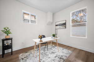 Office area featuring wood finished floors and plenty of natural light