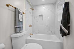 Full bath with toilet and  shower combination