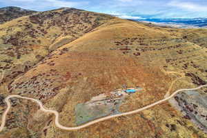 Aerial view of property's location with a mountain backdrop