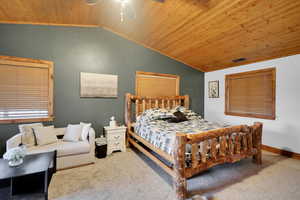 Bedroom featuring wooden ceiling, carpet floors, a ceiling fan, and vaulted ceiling