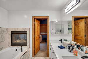 Bathroom with double vanity and a whirlpool tub