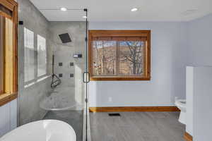 Bathroom featuring a stall shower and recessed lighting