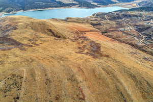 Aerial overview of property's location with a nearby body of water
