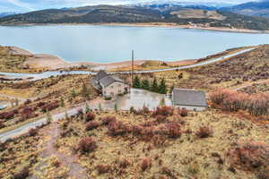 View of subject property featuring a water and mountain view