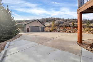 Garage featuring concrete driveway