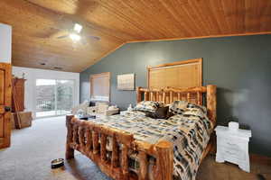 Bedroom featuring wood ceiling, carpet floors, access to outside, ceiling fan, and vaulted ceiling