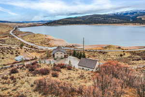 View from above of property with a mountain backdrop