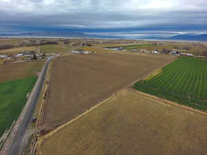 Aerial overview of property's location featuring rural landscape, mountains, and farmland