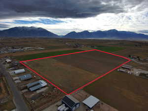 Overview of rural landscape featuring mountains and property parcel outlined