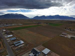Aerial view of sparsely populated area with a mountain backdrop